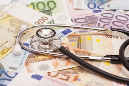 Euro banknotes and stethoscope
